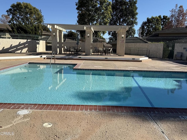 view of swimming pool with a patio