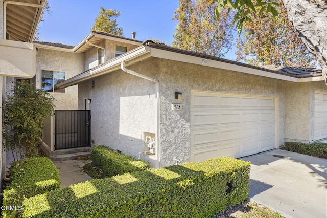 view of property exterior featuring a garage