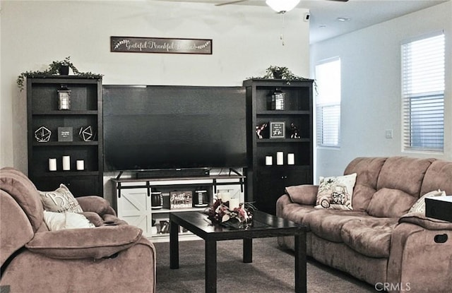 living room with carpet floors and ceiling fan