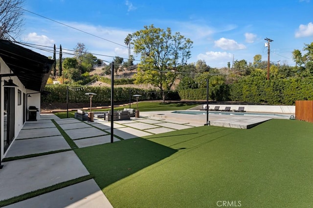 view of home's community with a swimming pool, outdoor lounge area, and a patio