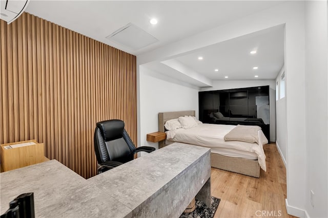 bedroom with light hardwood / wood-style floors