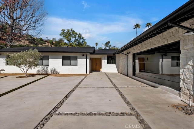 rear view of property featuring a patio