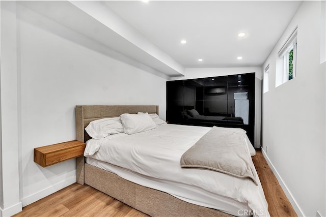 bedroom with hardwood / wood-style floors