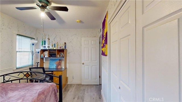 bedroom featuring ceiling fan and light hardwood / wood-style flooring