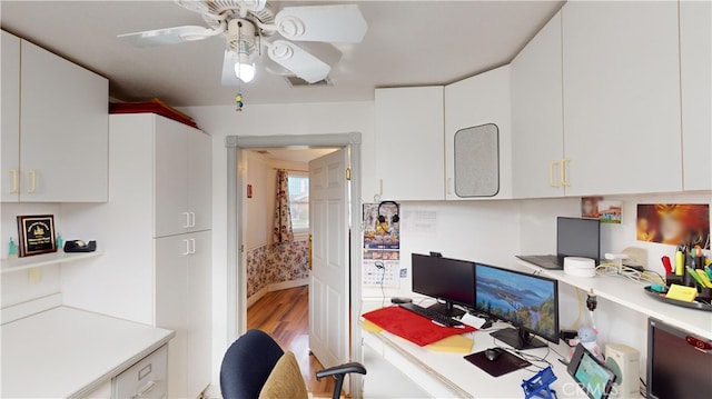 office space with ceiling fan and light hardwood / wood-style flooring