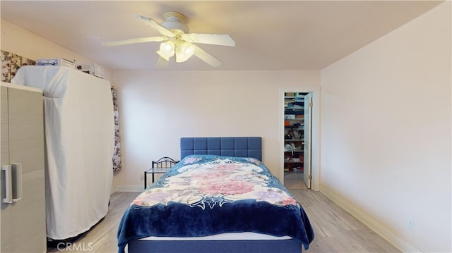 bedroom featuring a closet, ceiling fan, and light hardwood / wood-style flooring