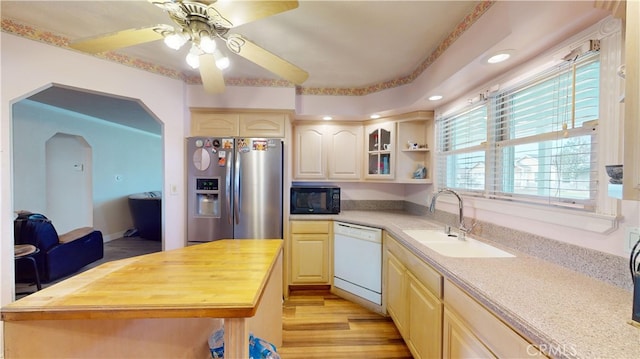 kitchen featuring wood counters, stainless steel refrigerator with ice dispenser, sink, white dishwasher, and light hardwood / wood-style flooring