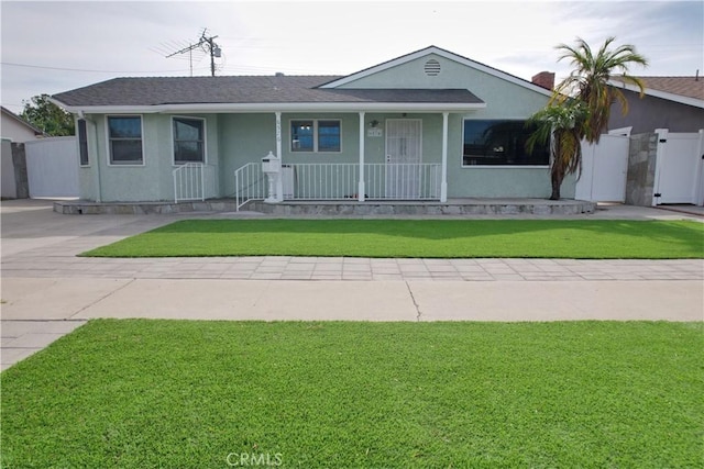 single story home featuring a front lawn and a porch