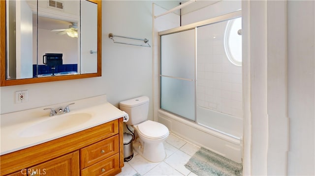 full bathroom with tile patterned floors, ceiling fan, toilet, shower / bath combination with glass door, and vanity