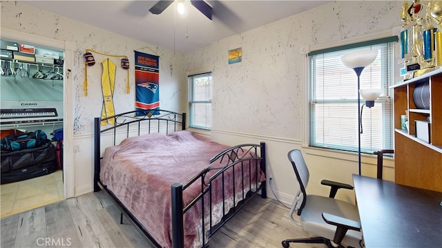 bedroom featuring a closet, ceiling fan, and hardwood / wood-style floors