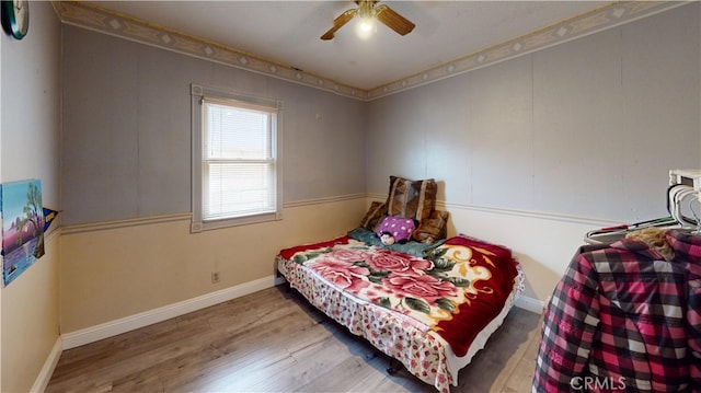 bedroom featuring ceiling fan and wood-type flooring