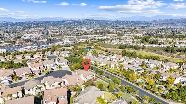 birds eye view of property featuring a mountain view