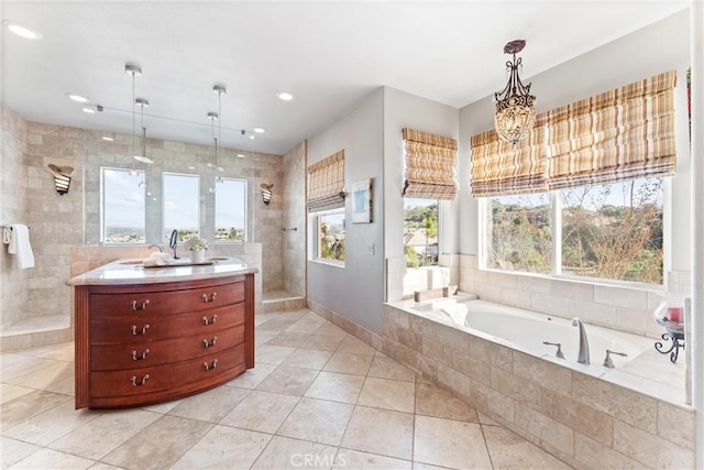 bathroom featuring tile patterned floors and independent shower and bath