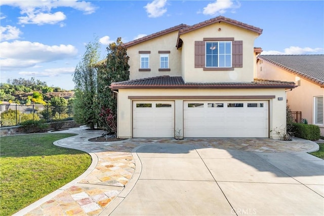 view of front of home with a front yard and a garage