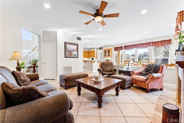 living room with ceiling fan and light tile patterned floors