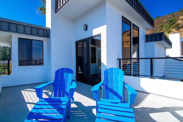 view of patio / terrace with a balcony