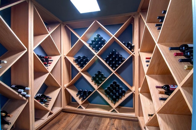 wine room with wood finished floors