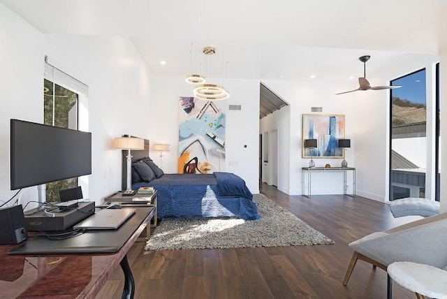 bedroom with dark hardwood / wood-style floors