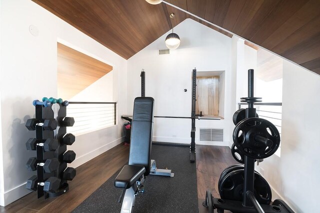 workout room featuring wooden ceiling and vaulted ceiling