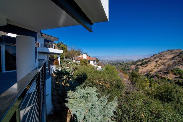 balcony featuring a mountain view