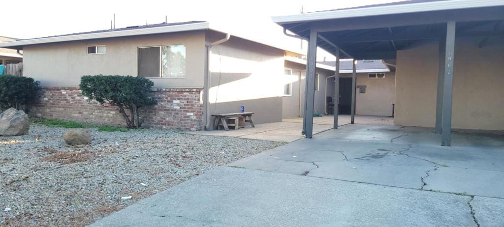 view of property exterior featuring a carport