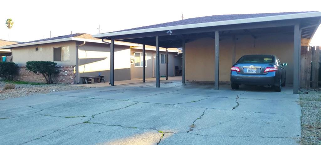 exterior space featuring a carport