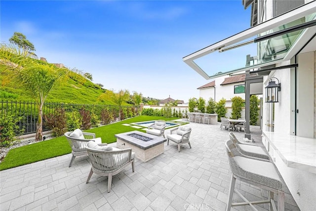 view of patio with an outdoor fire pit