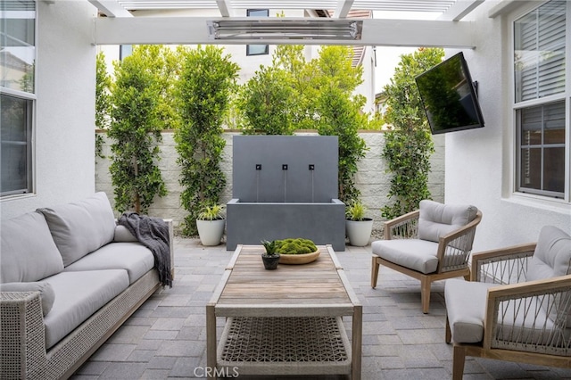 view of patio with an outdoor living space and a pergola