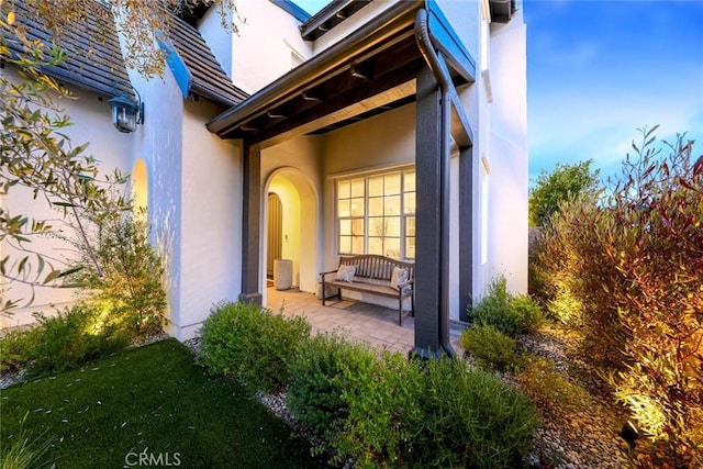 doorway to property featuring a patio area