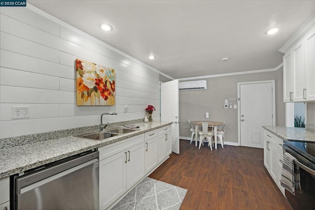 kitchen with crown molding, sink, white cabinets, an AC wall unit, and stainless steel appliances