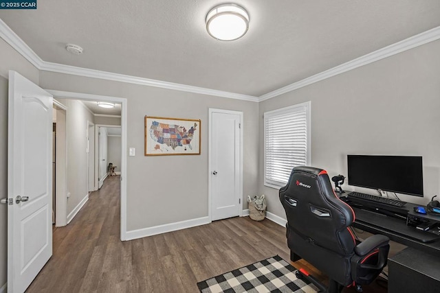 home office featuring hardwood / wood-style floors and ornamental molding