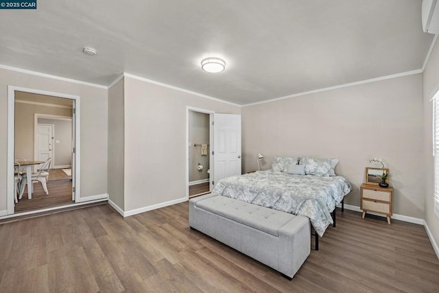 bedroom featuring wood-type flooring, a wall mounted AC, and ornamental molding