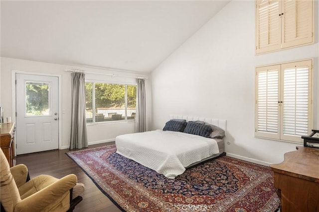 bedroom featuring multiple windows, high vaulted ceiling, and dark hardwood / wood-style floors