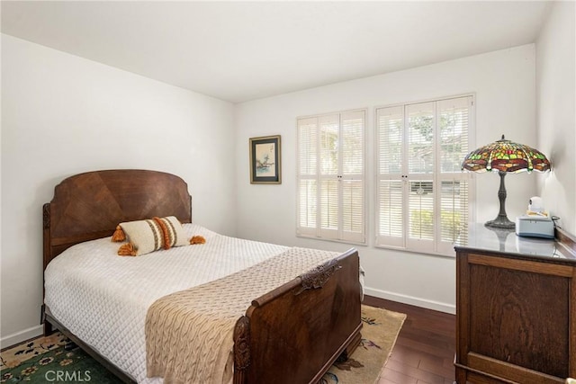 bedroom featuring dark wood-type flooring