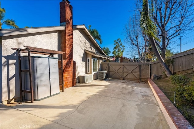 view of side of property featuring a patio