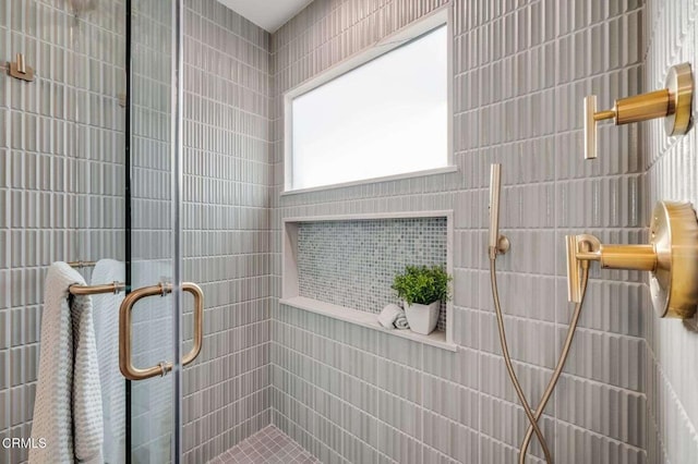 bathroom featuring an enclosed shower