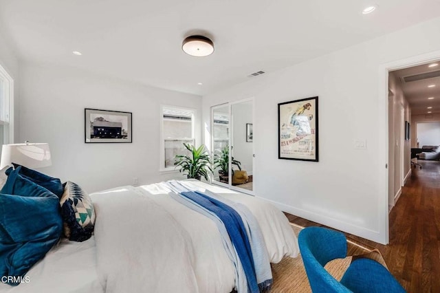 bedroom featuring dark hardwood / wood-style flooring