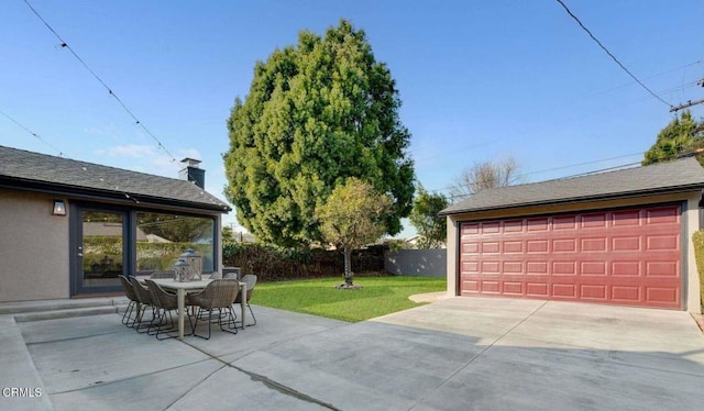 view of patio / terrace featuring a garage