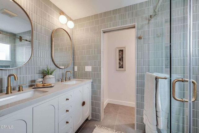 bathroom with tile walls, tile patterned floors, and vanity