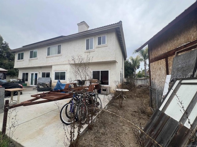 back of property featuring a patio