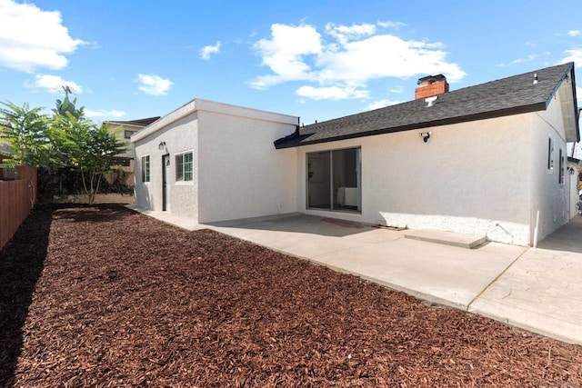 back of property featuring a patio