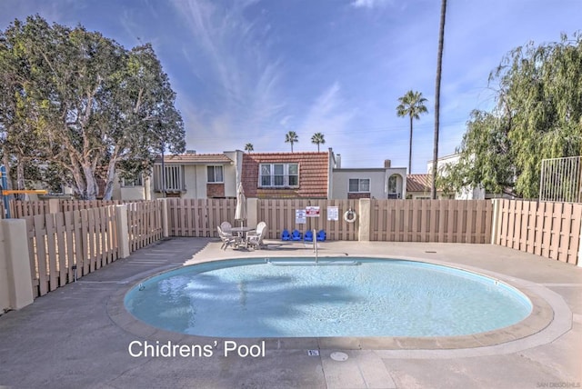 view of swimming pool featuring a patio