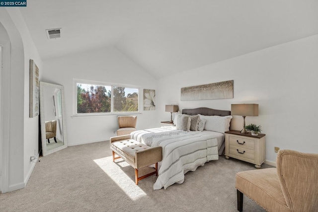 bedroom with light carpet and vaulted ceiling