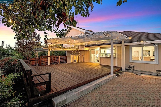 deck at dusk with a pergola