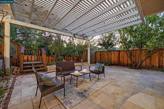 view of patio / terrace with an outdoor living space and a pergola