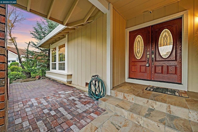 exterior entry at dusk with a porch