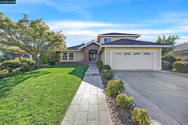 view of front facade with a garage and a front lawn