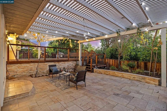 patio terrace at dusk featuring a pergola