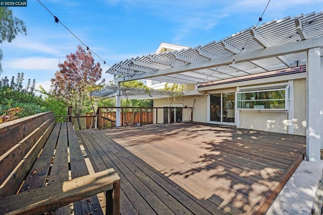 wooden deck featuring a pergola