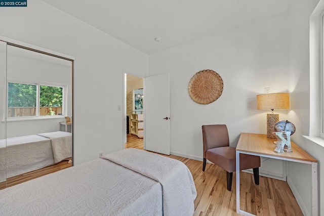 bedroom with light hardwood / wood-style floors